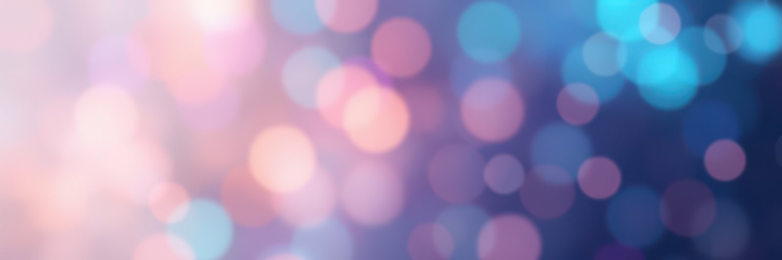 Colorful blurred lights create a dreamy atmosphere in a festive setting during the evening